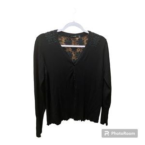 Black button front Sweater with lace trim detail.